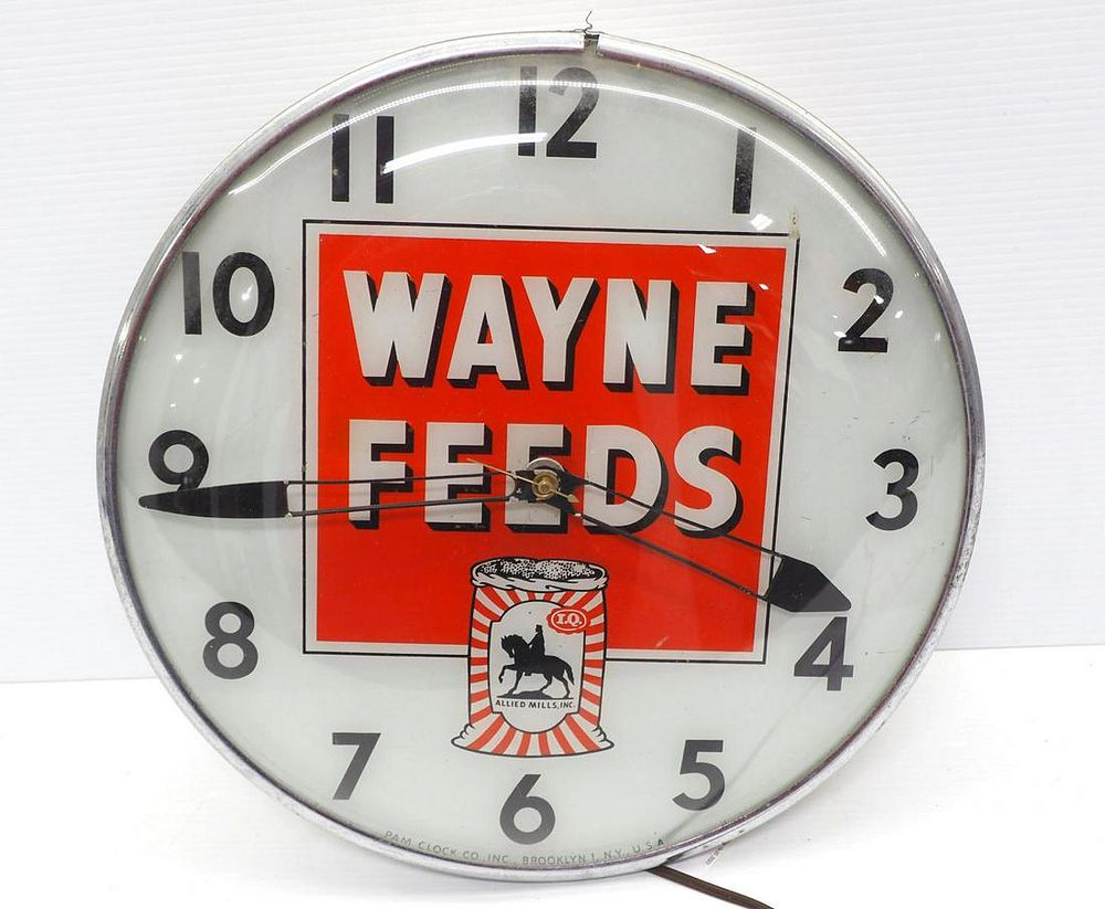 Lot 690: Lighted Wayne Feeds clock