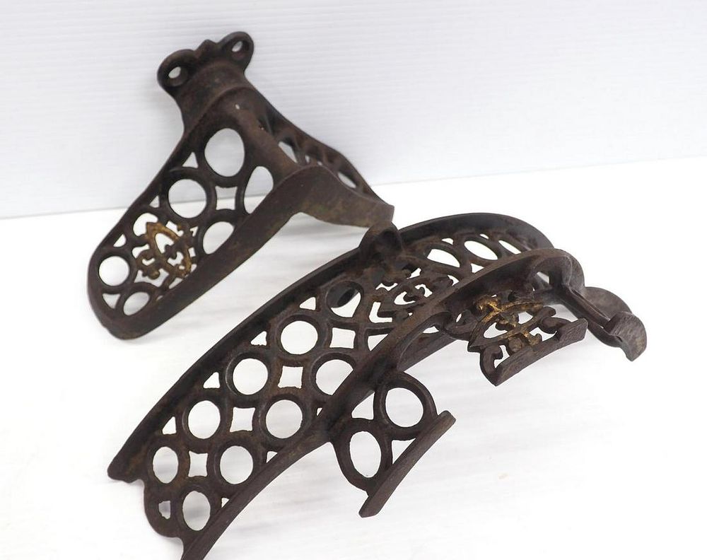 Lot 740: (2) Cast iron harness /bridle holders