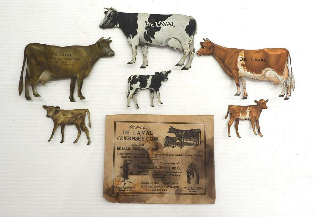 Lot 780: (3) DeLaval tin cows and calves