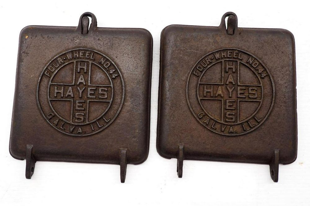 Lot 850: (2) Cast iron Hayes planter lids