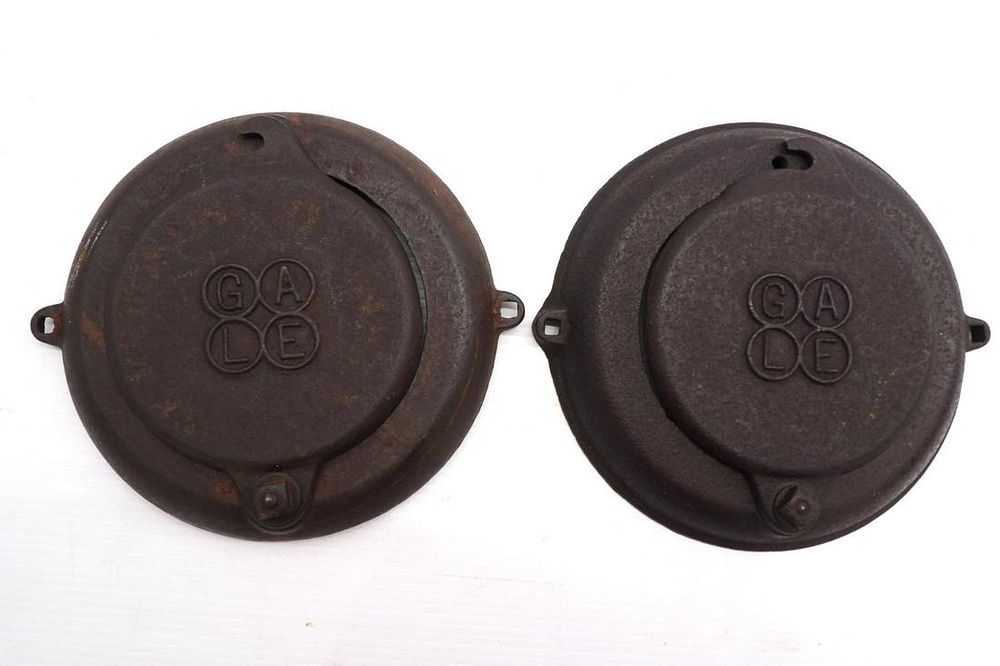 Lot 870: (2) Gale cast iron planter lids