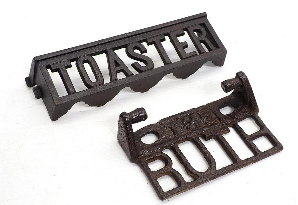 Lot 873: (2) Cast iron stove attachments