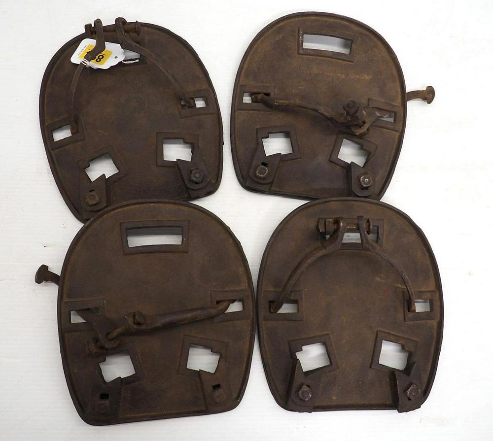 Lot 894: (4) Cast iron horse mud shoes