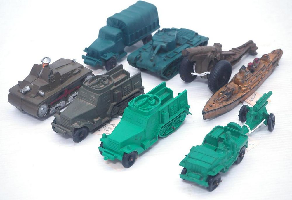 Lot 318: (8) Auburn Rubber army toys