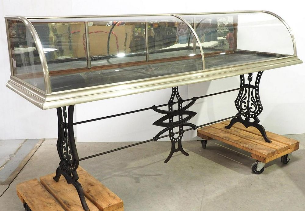 Lot 1763: Curved glass, nickel-plate & wood showcase