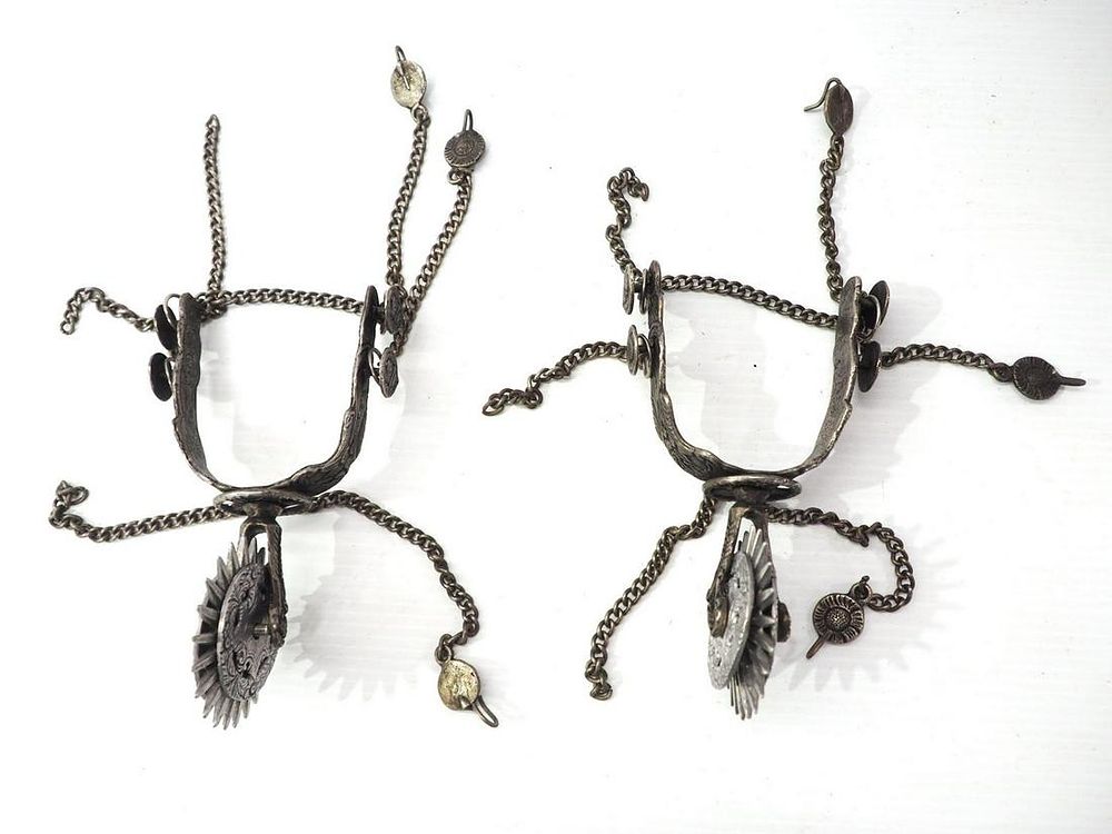 Lot 673: Very fancy silver spurs