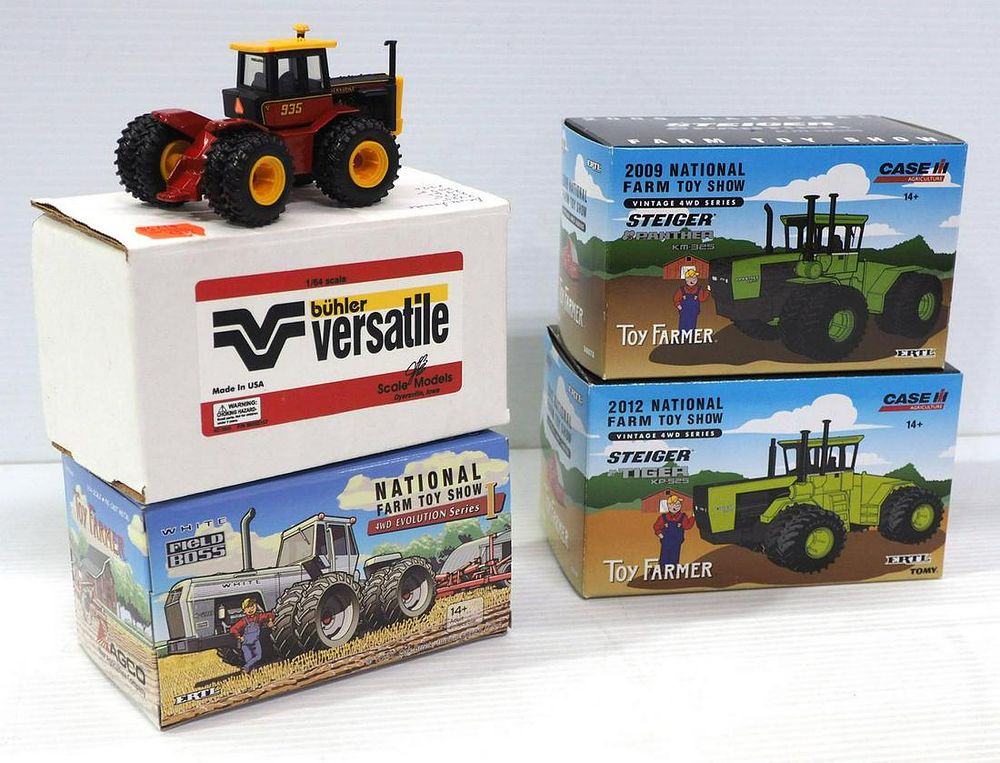 Lot 319: (4) 1/64 scale Toy Tractors