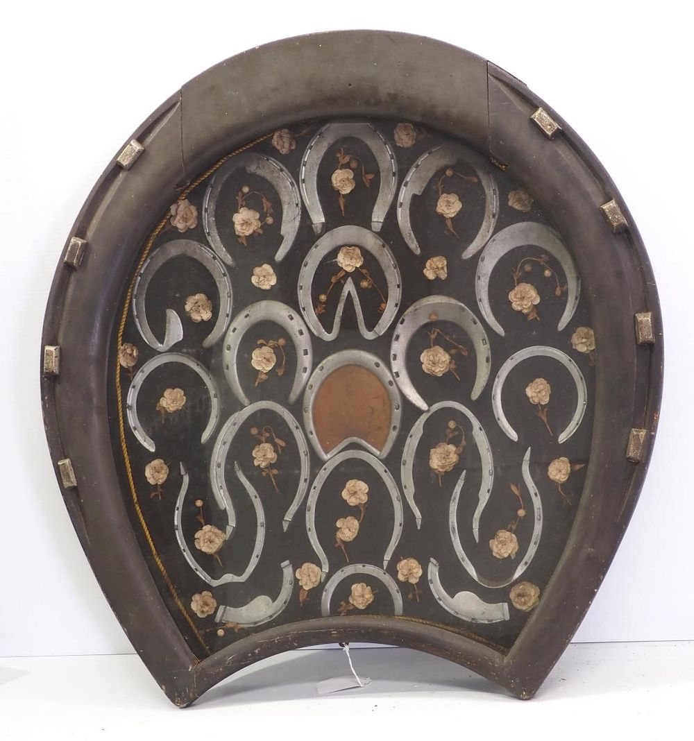 Lot 196: Horseshoe-shaped shadow box with horseshoes