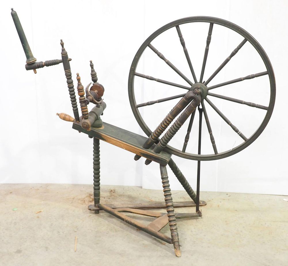 Lot 297: Wooden, turned leg spinning wheel