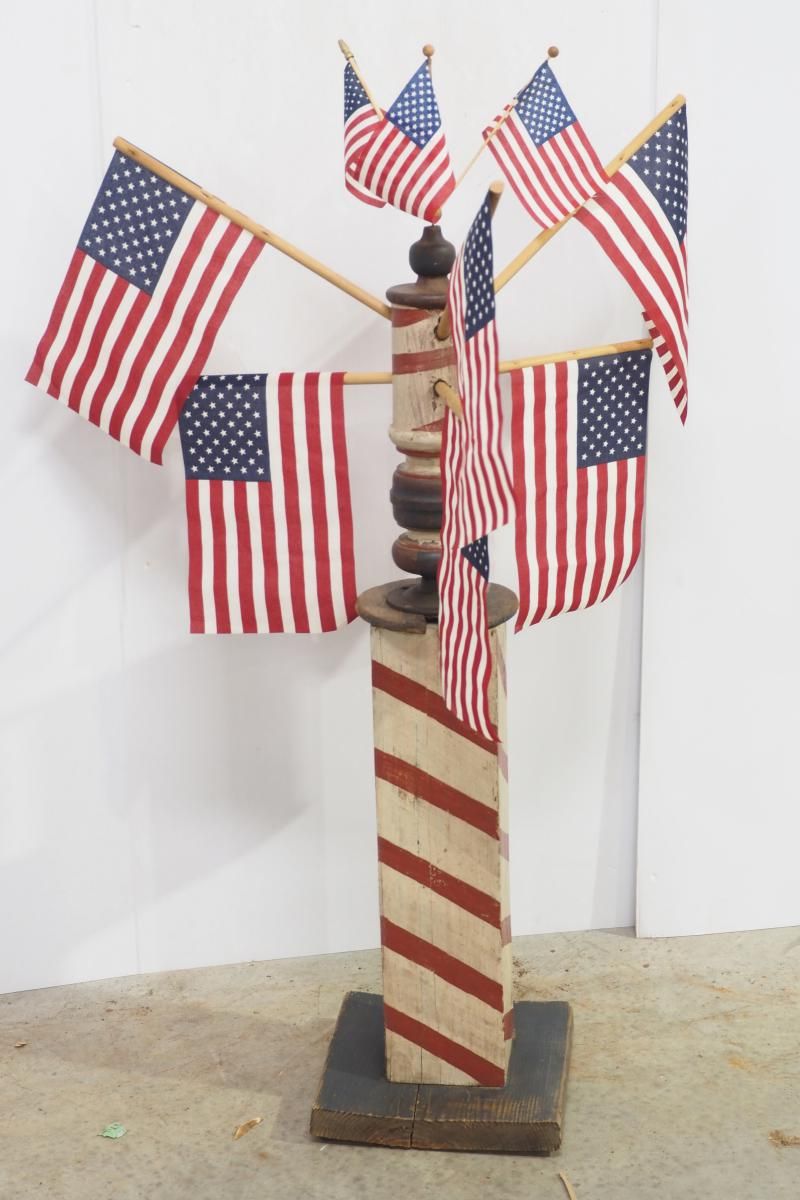 Lot 1318: Wooden barber pole with flags
