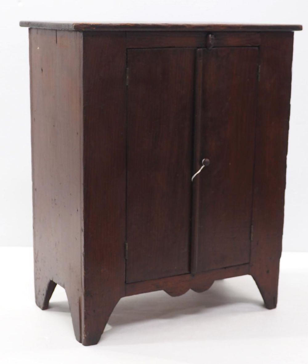 Lot 1345: Early wooden miniature cupboard