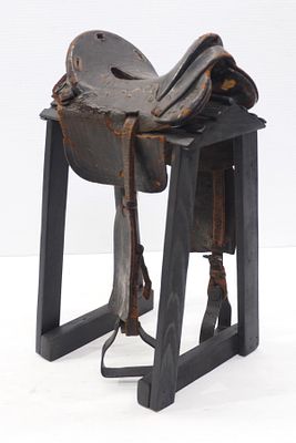 Model leather McClellan cavalry saddle stamped '48' on one side, metal stirrups and wooden 