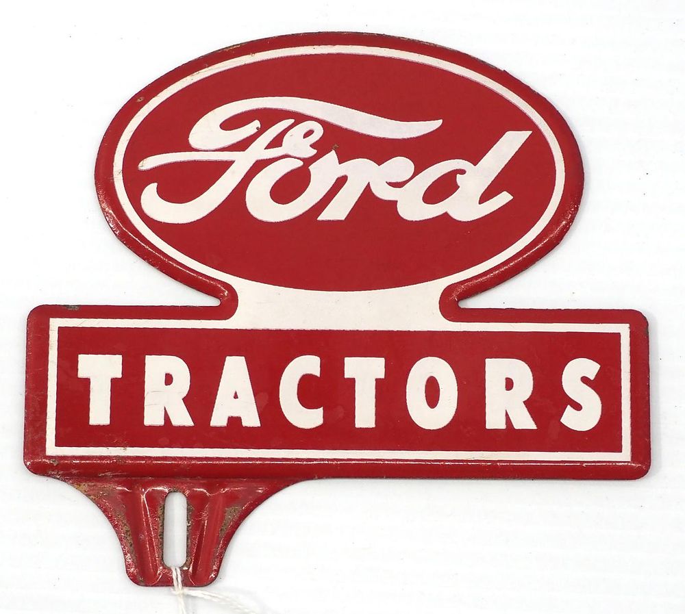 Lot 157: Ford Tractors tin license plate topper