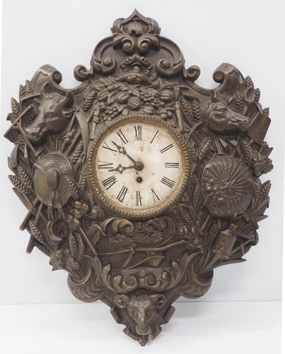 Lot 207: Cast iron decorative wall clock with farm images
