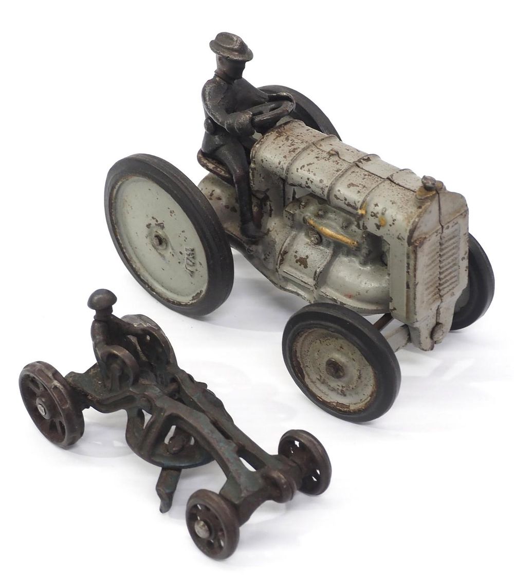 Lot 283: Cast iron tractor marked W&K / Cast iron grader