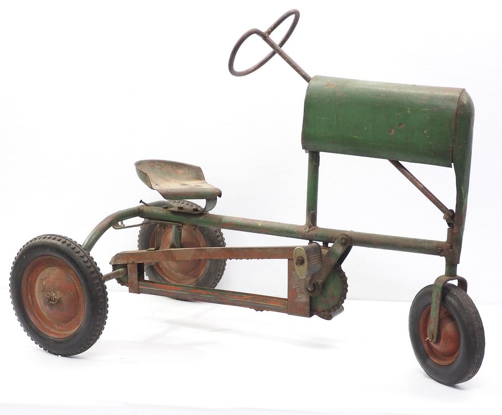 Lot 340: Early metal child's pedal tractor