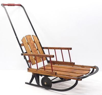 Tiny Tot child's sled with wheels. Tiny Tot child's sled with push handle and wheels, and 