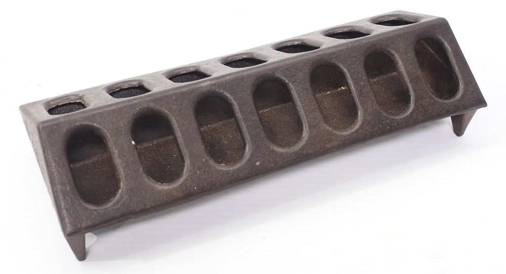 Lot 603: Cast iron chicken feeder