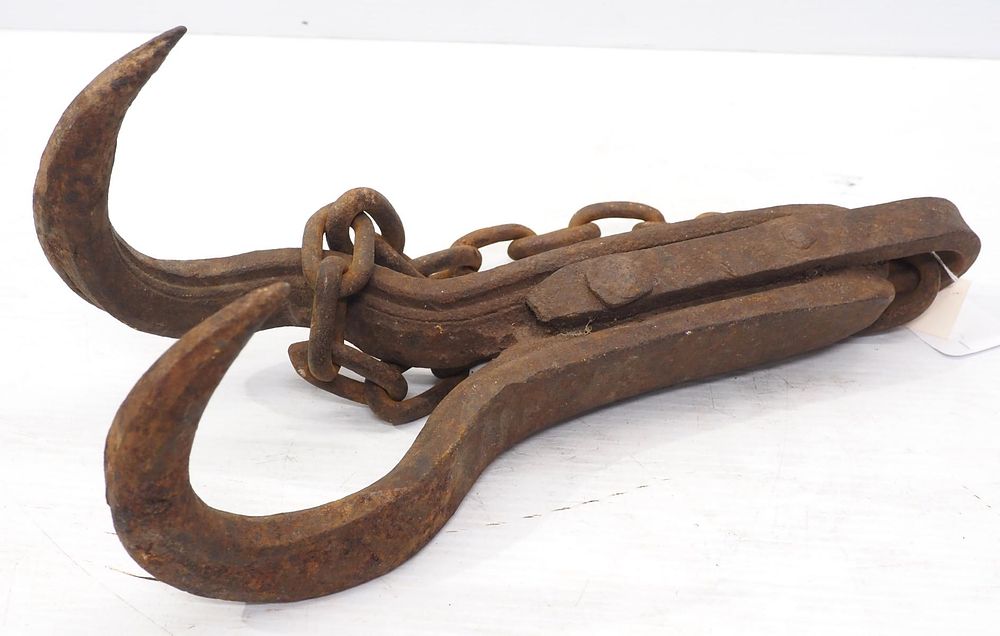 Lot 626: Cast iron stump puller with chain