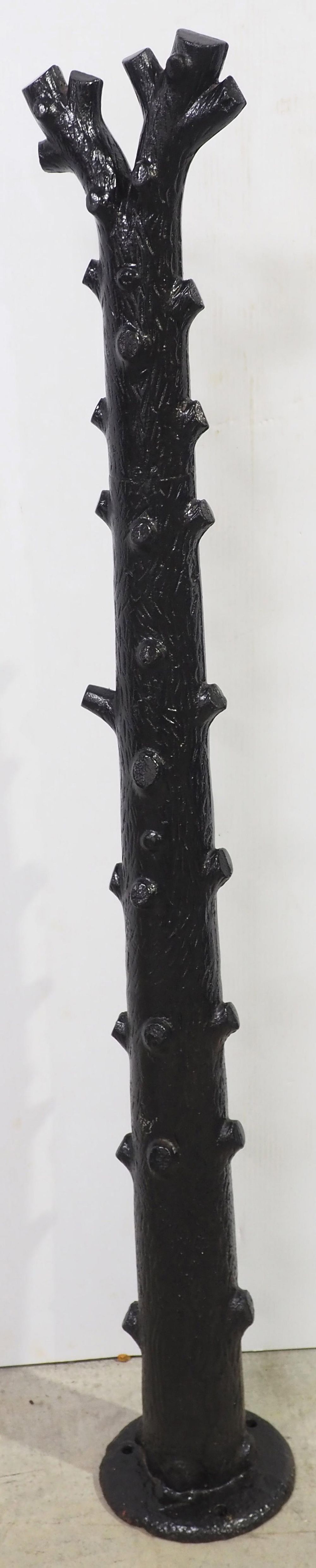 Lot 811: Cast iron tree limb horse hitching post