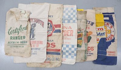 Assorted cloth feed bags including Purina Chowder, alfalfa seed, Glick's, Pilgrim, DeKalb & more