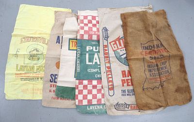 Assorted cloth feed bags including Statesville, Arnold, Trisler, Purina Layena, Glidden & more