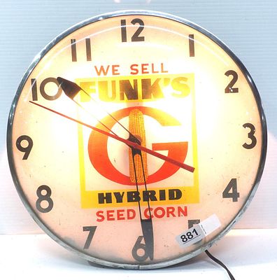 We Sell Funk's Hybrid Seed Corn lighted clock. 15"dia. metal & glass We Sell Funk's Hybrid Seed 
