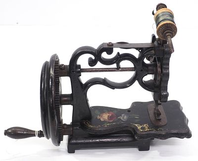 Early hand-crank sewing machine with beautiful floral paint details, 10"L x 8"H