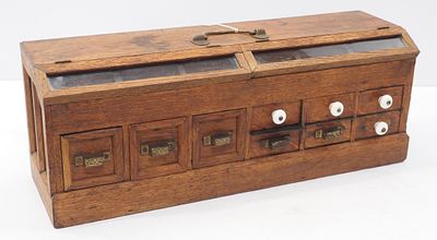 Salesman sample wooden seed counter with handle for transport and lift up seed displays 