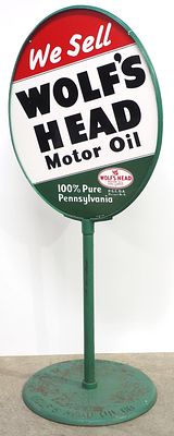 Wolf's Head Motor Oil sign. 23"x30" DSP Wolf's Head Motor Oil sign on cast iron Wolf's Head 
