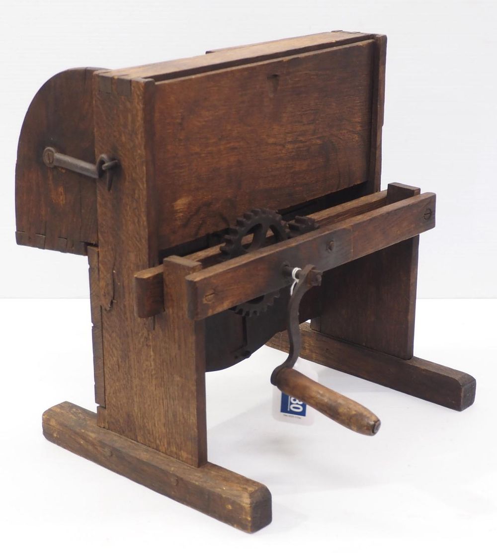 Lot 1380: Early wooden hand-crank vegetable slicer