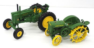 (2) Ertl John Deere tractors. (2) 1/16 scale Ertl John Deere tractors, including Model G and 