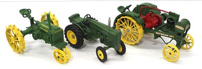 (3) Ertl John Deere tractors. (3) 1/16 scale Ertl John Deere tractors: M, Waterloo Boy, and GP - 