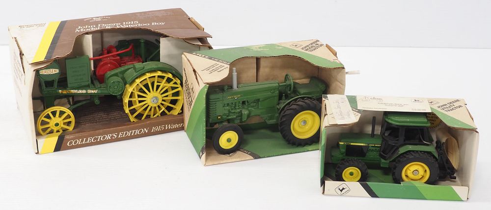 Lot 248: (3) Ertl John Deere tractors