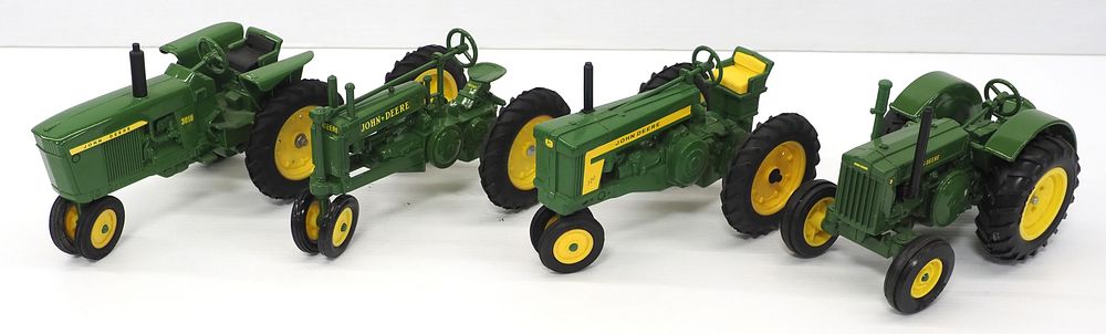 Lot 291: (4) Ertl John Deere tractors