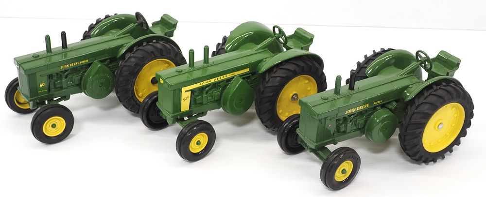Lot 301: (3) Ertl John Deere tractors