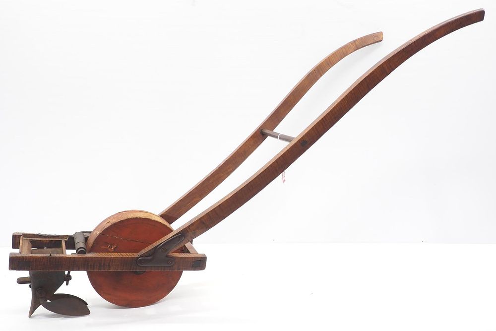 Lot 356: Early wooden push seeder