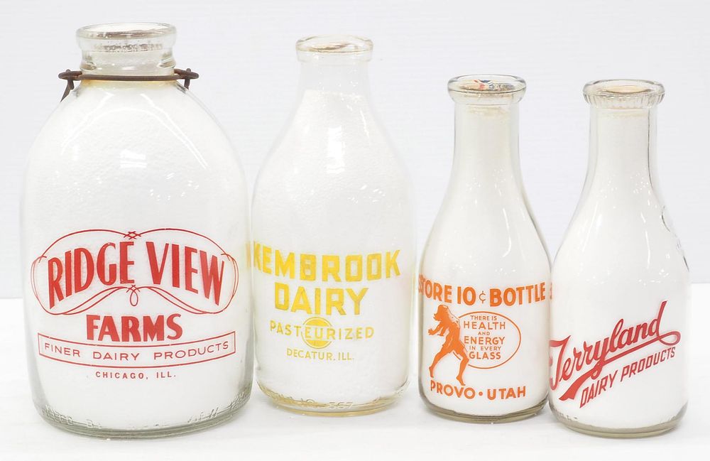 Lot 403: (4) Advertising milk bottles