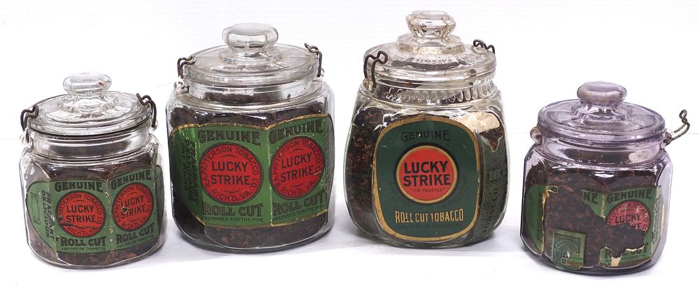 (4) Lucky Strike glass country store tobacco jars with paper labels, 5.5" & 4" dia., selling 