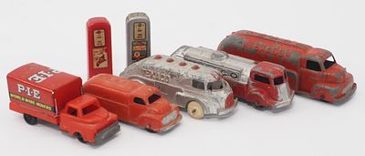 Box lot of trucks. Box lot of (3) Texaco pressed steel trucks, (1) PIE box truck and others