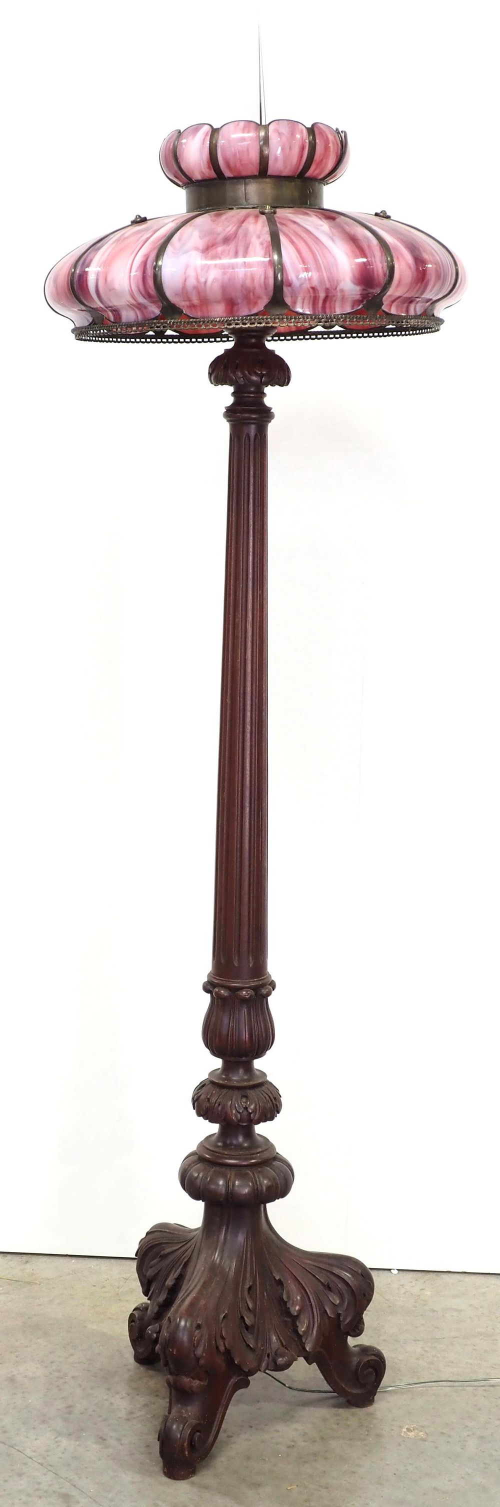 Lot 209: Mahogany Floor Lamp with Elaborate Carved Base and Pink Slag Glass Shade