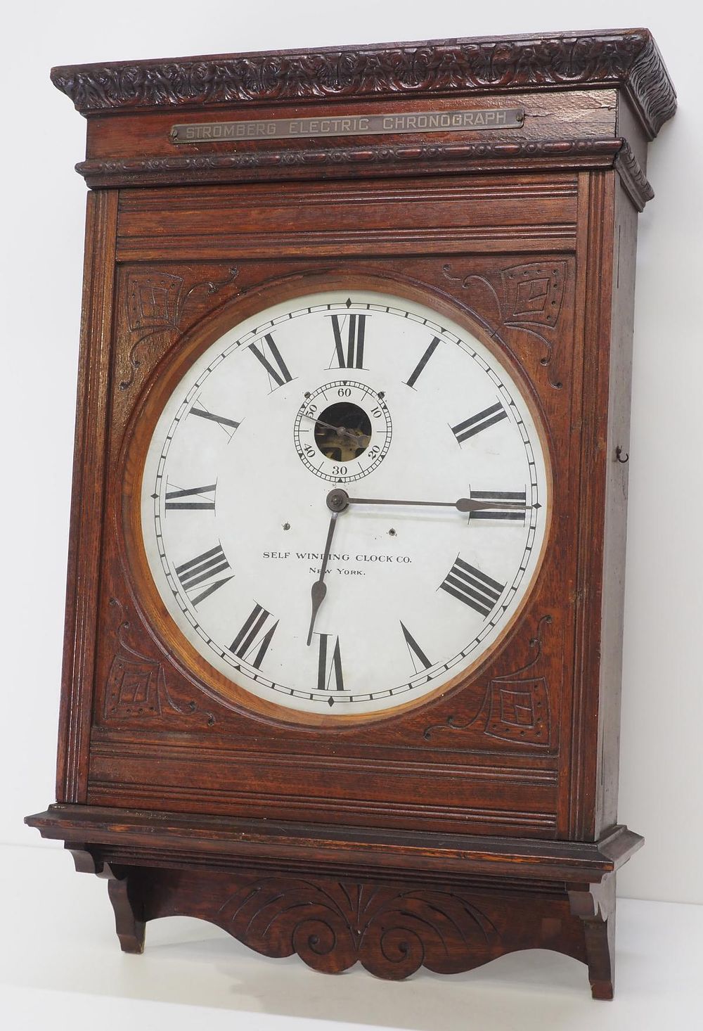 Lot 231: Pencil Carved Quartersawn Oak Self-Winding Wall Clock