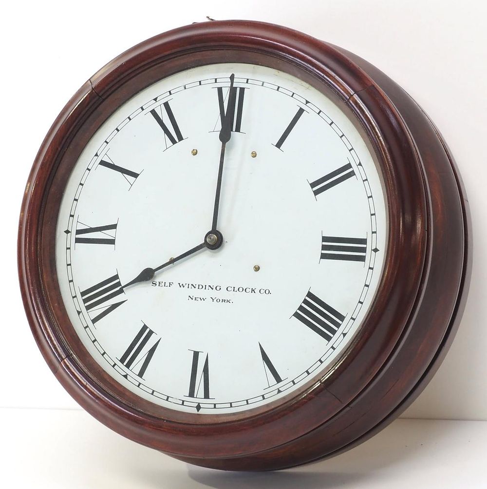 Lot 291: Round Mahogany Cased Secondary Wall Clock
