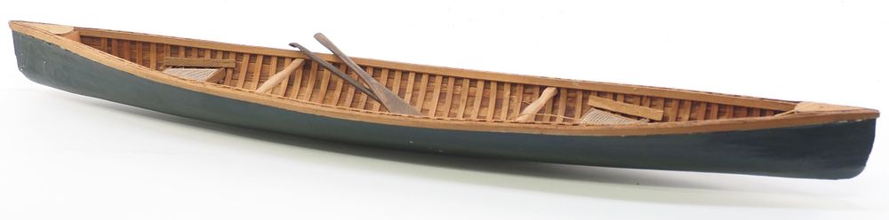 Lot 216: Model wooden canoe with paddles
