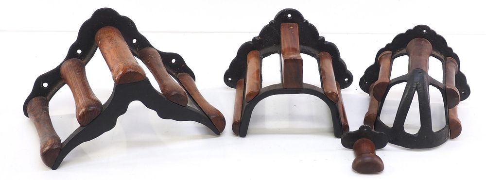 Lot 257: (4) Wood & cast iron, wall-mount harness racks