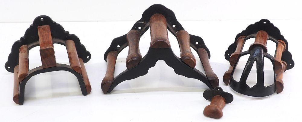 Lot 259: (4) Wood & cast iron, wall-mount harness racks