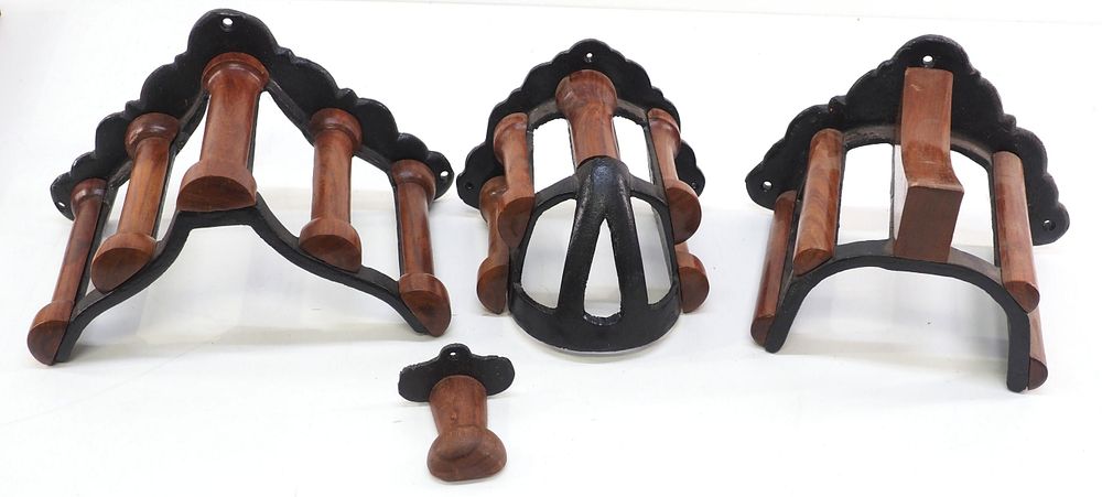 Lot 260: (4) Wood & cast iron, wall-mount harness racks