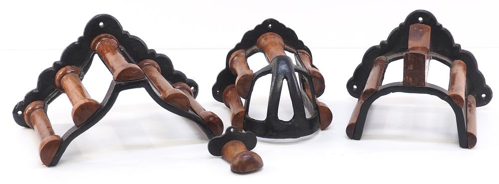 Lot 265: (4) Wood & cast iron, wall-mount harness racks