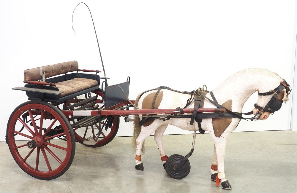Lot 419: Early child's pedal horse & sulky