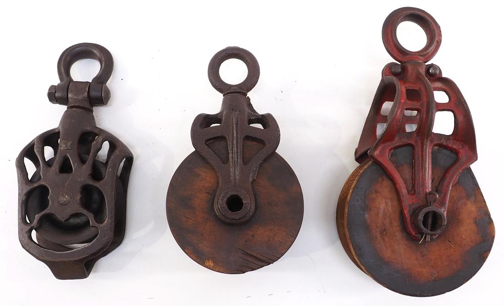 Lot 674: (3) Wood & cast iron pulleys